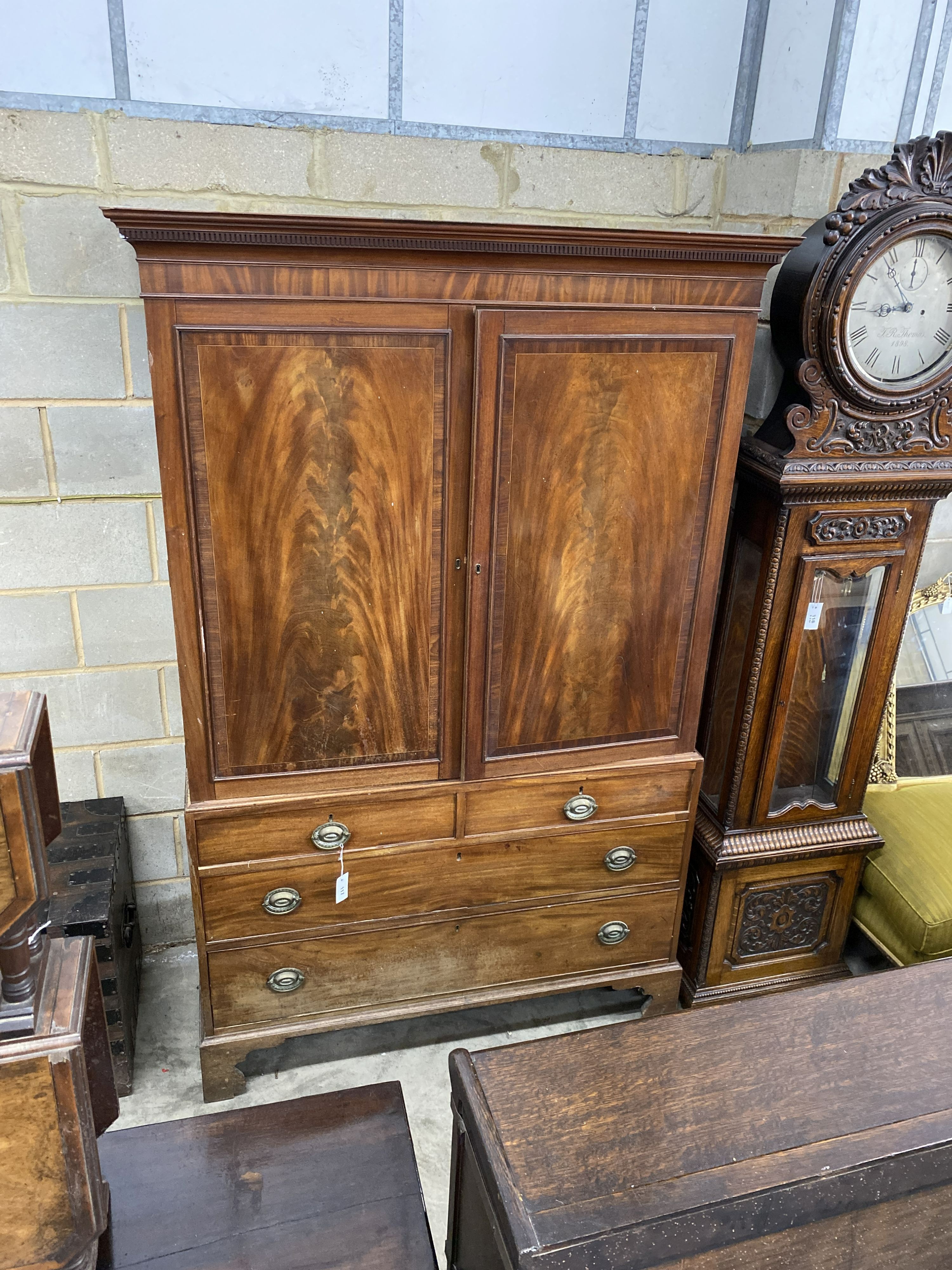 A George III mahogany linen press, width 135cm, depth 56cm, height 206cm